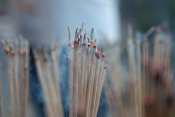 Blur burning incense and candle  for backgroud,abstract