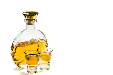 Bottle and two shot glasses tequila on white background