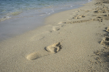 fine sandy beach with footprints of people on its surface