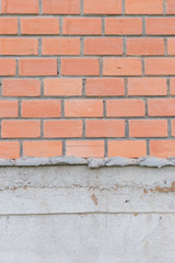 Brick wall under construction.