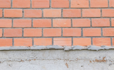 Brick wall under construction.