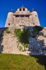 Stone walls and towers of a medieval castle in the town of Provins, France. © GKor