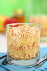 Simple no-bake Danish apple cake called Aeblekage made of stewed apple and vanilla cookie crumbs (Selective Focus, Focus on the front of the two upper layers)