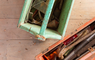 Wooden toolbox with tools on wood balckground
