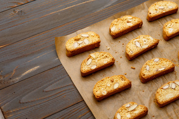 Italian cantuccini cookie with almond filling on wooden background