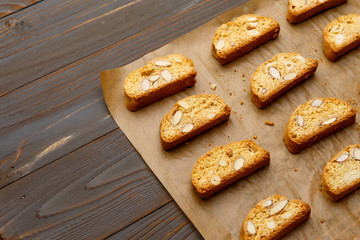 Italian cantuccini cookie with almond filling on wooden background