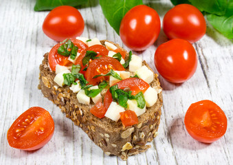 Ciabatta bread with tomatoes, mozzarella and basil.