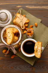 Italian cantuccini cookie with almond filling on wooden background