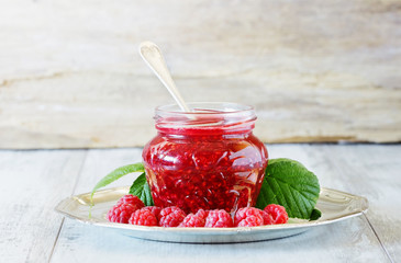 Raspberry jam in a glass jar