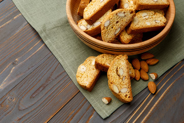Italian cantuccini cookie with almond filling on wooden background