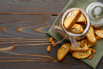 Italian cantuccini cookie with almond filling on wooden background