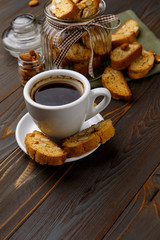 Italian cantuccini cookie with almond filling on wooden background