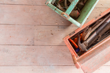 Wooden toolbox with tools on wood balckground