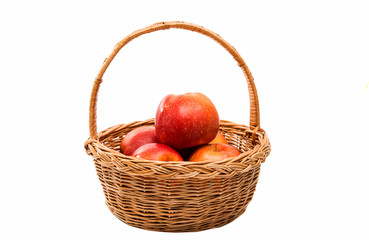 red apples in a basket isolated