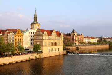 Fototapeta na wymiar Old Town ancient architecture and Vltava river pier in Prague