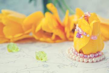 Obraz na płótnie Canvas yellow tulip with beads Macro