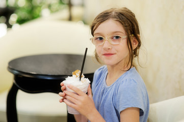 Adorable girl with coffee