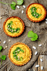 buckwheat tartlets with with white beans carrot hummus and cilan