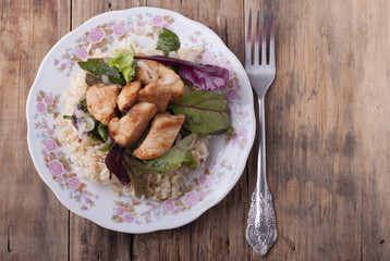  Fried chicken with rice and salad.