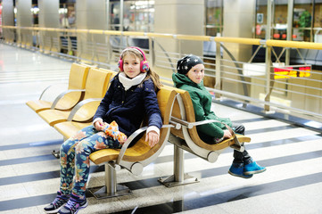 two kid girls in the subway