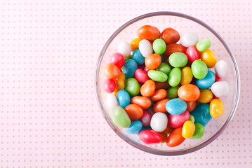 colorful candies in a bowl on a table