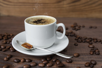 A cup of coffee and coffee beans
