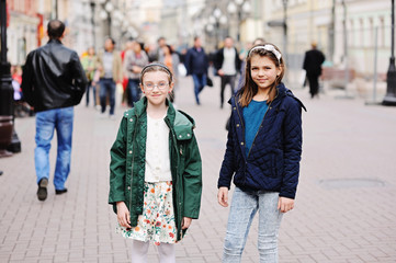Two kid girls on city streets