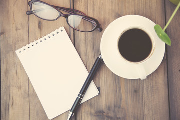 notepad,coffee,pen and glasses