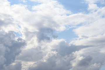 Blue sky with spindrift clouds.