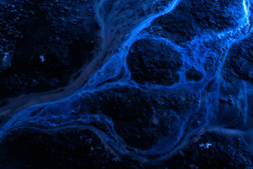 Industrial Oil Spill on Water in Blue Tone