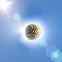 Aerial city view with crossroads, roads, houses, buildings, parks and parking lots, bridges. Copter shot. Little planet mode.