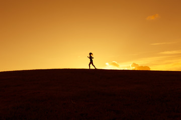 Silhouette of a girl running 
