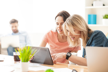 Attractive two female colleagues are making a break