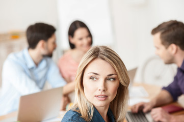 Obraz premium Cheerful four workers are talking in office