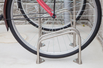 Fototapeta na wymiar Locked bicycle at bicycle outdoor parking space