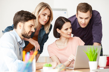 Pretty office workers are discussing a project