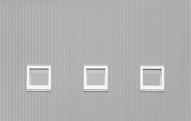 Detail of house exterior wall and window.