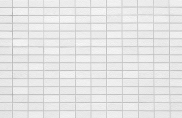 The modern white concrete tile wall background and texture..