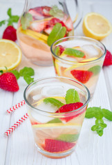 Strawberry mint homemade lemonade on white wooden table