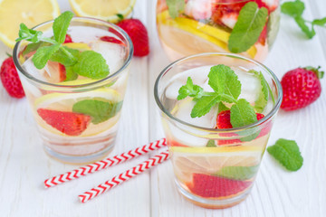 Strawberry mint homemade lemonade on white wooden table