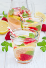 Strawberry mint homemade lemonade on white wooden table