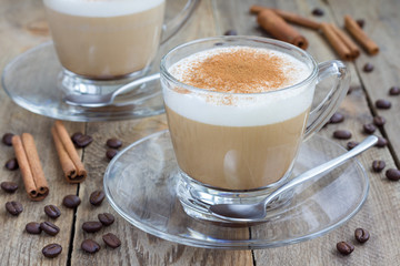 Coffee latte in glass cups on a wooden table