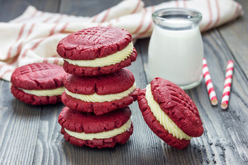 Red velvet sandwich cookies with milk