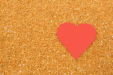 Millet cereal grains with heart - health concept