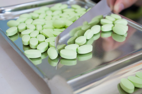 medicine pills on counting tray - Powered by Adobe