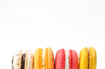 Close up of french colorful macarons isolated on white background