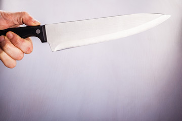 holding a kitchen knife