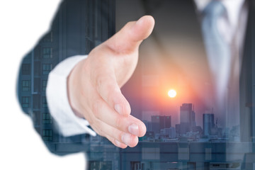 isolated and double exposure of businessman extending hand to shake with city scape.