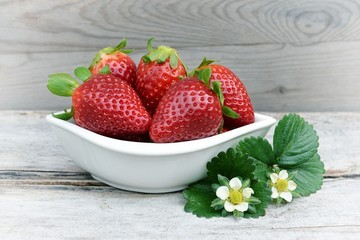 Fresh strawberry on a wooden background. 
