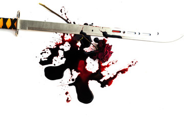 Conceptual image of a sharp knife with blood on it resting on tiles on the floor